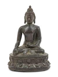 A Tibetan Bronze Figure of Seated Buddha Akshobhya