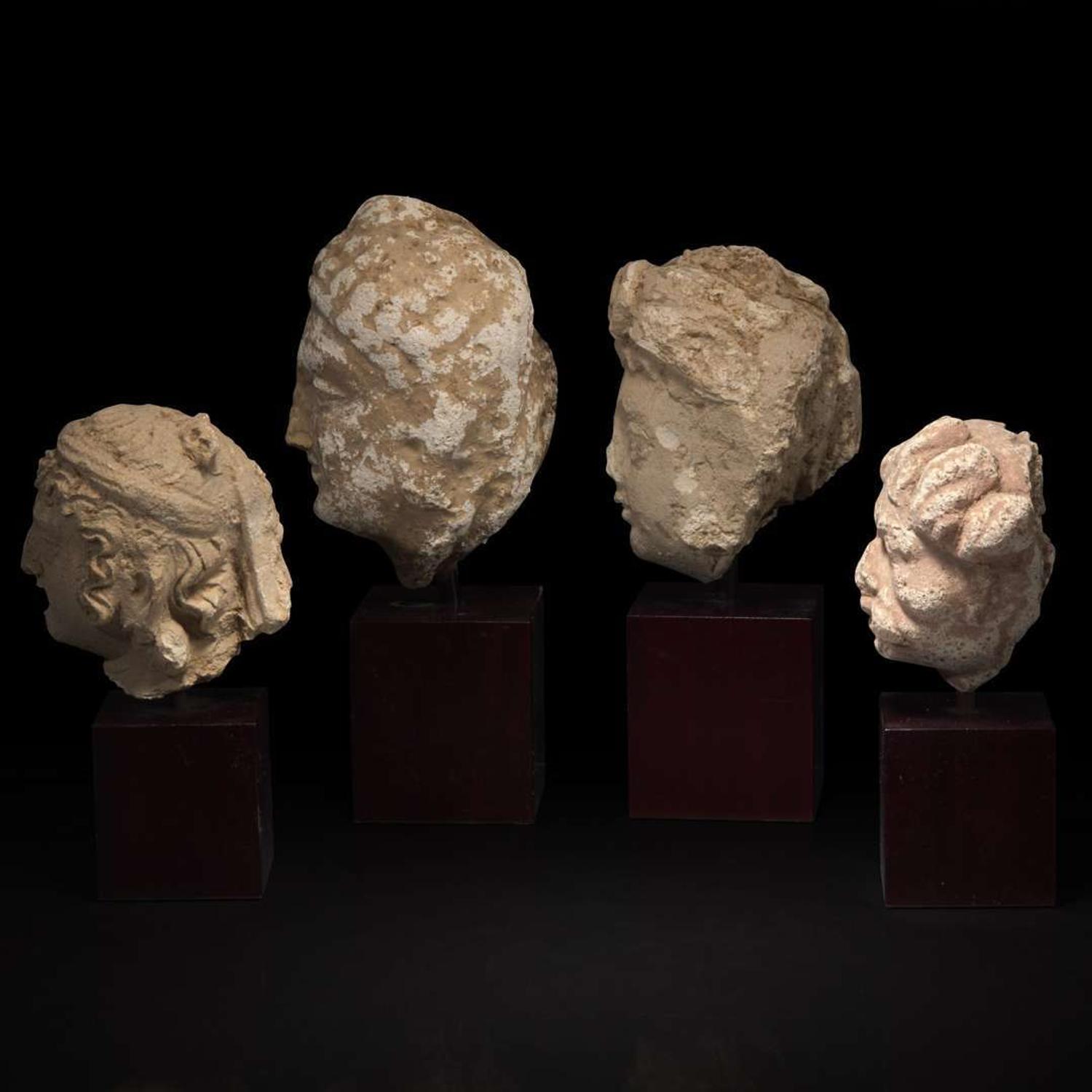 A group of four small stucco heads 石灰岩佛首一组四件 Gandhara, 4rd-5th Century ??? ?????