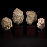 A group of four small stucco heads 石灰岩佛首一组四件 Gandhara, 4rd-5th Century ??? ?????