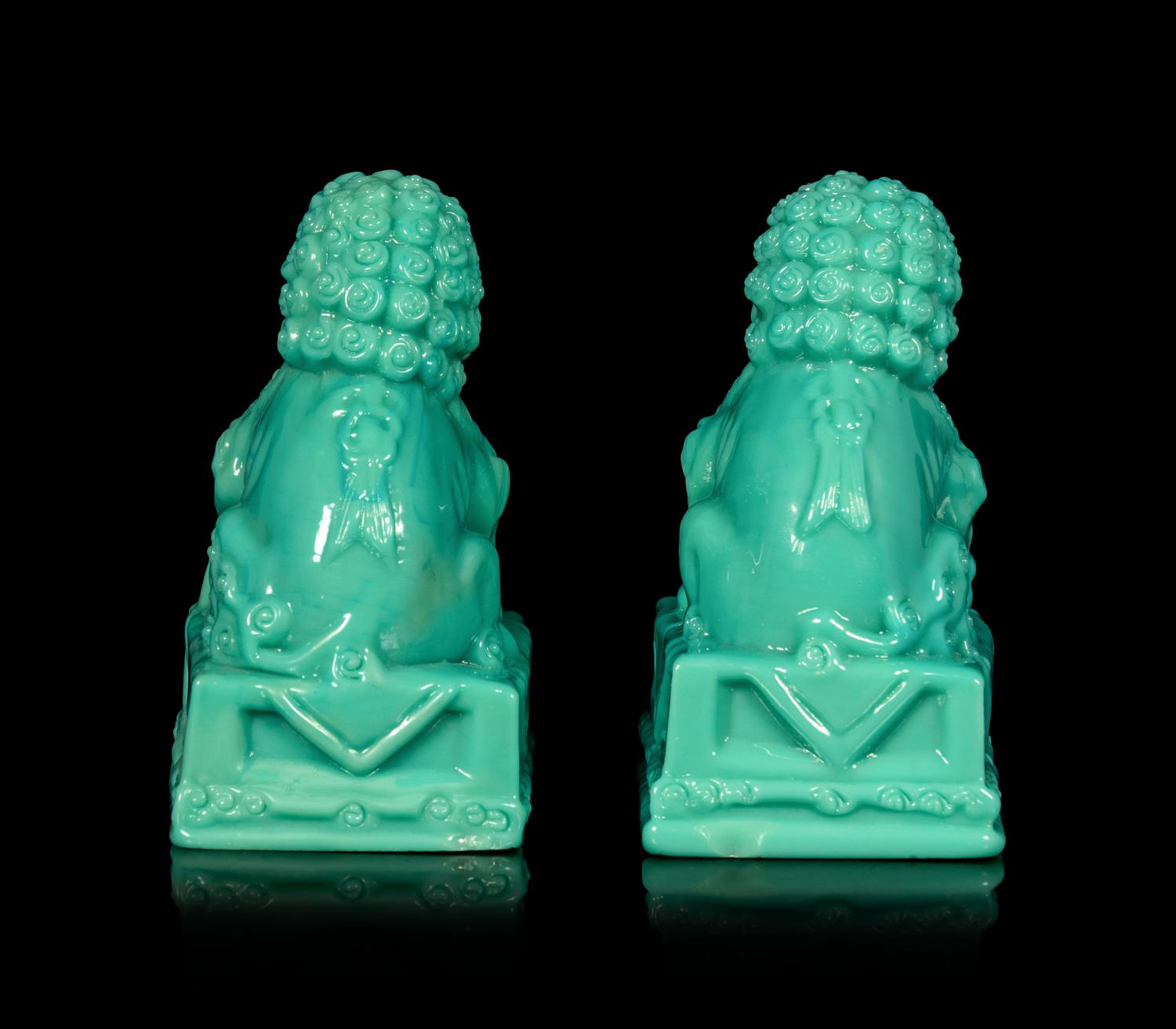 A Pair of Chinese Molded Glass Figures of Fu Lions