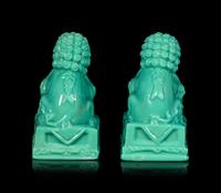 A Pair of Chinese Molded Glass Figures of Fu Lions