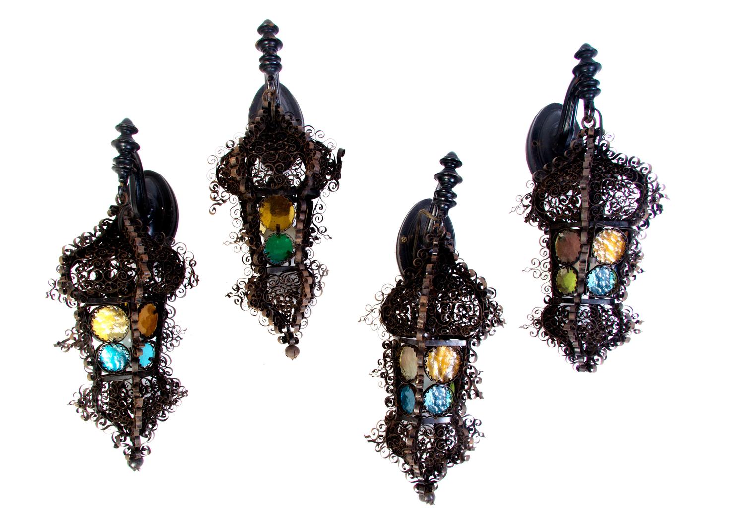 Four Continental Iron and Glass Lanterns, Height of first 22 inches.