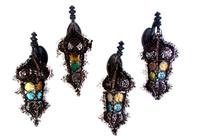 Four Continental Iron and Glass Lanterns, Height of first 22 inches.
