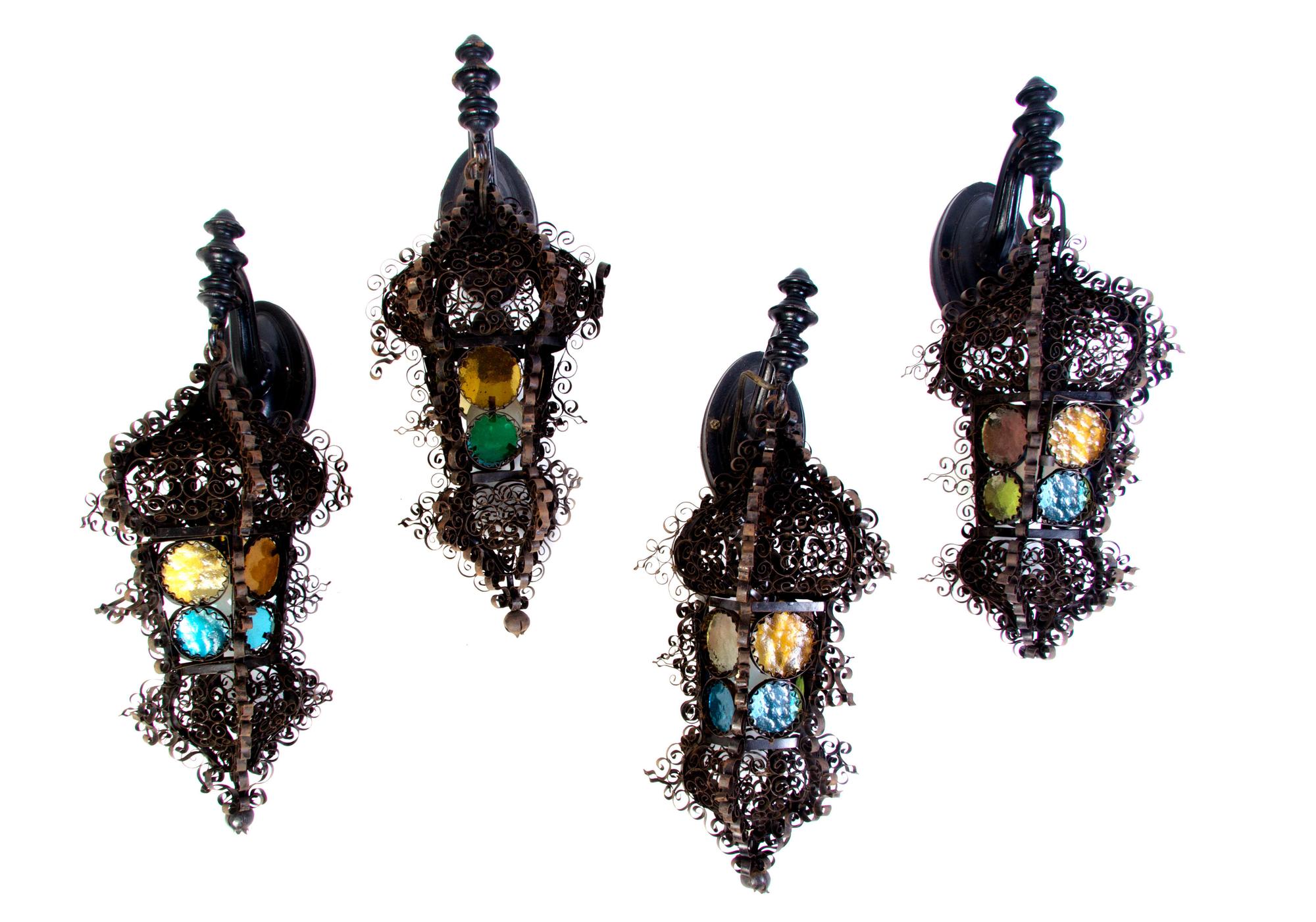 Four Continental Iron and Glass Lanterns, Height of first 22 inches.