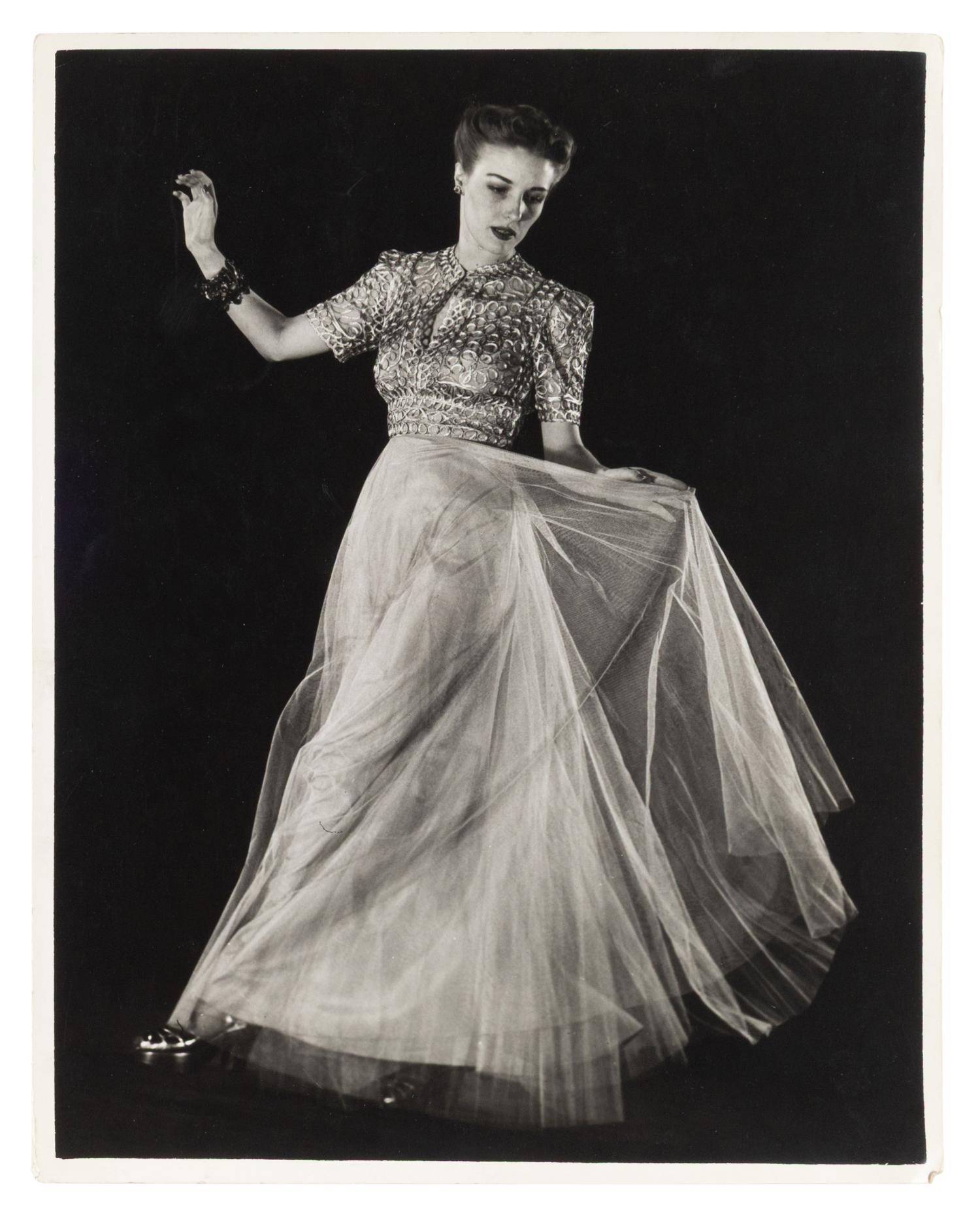 Model wearing evening dress of net skirt with silver metal bodice and Model wearing gold brocade evening dress (two works), 1938; printed ca. 1938