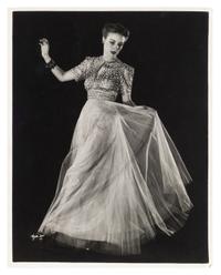 Model wearing evening dress of net skirt with silver metal bodice and Model wearing gold brocade evening dress (two works), 1938; printed ca. 1938