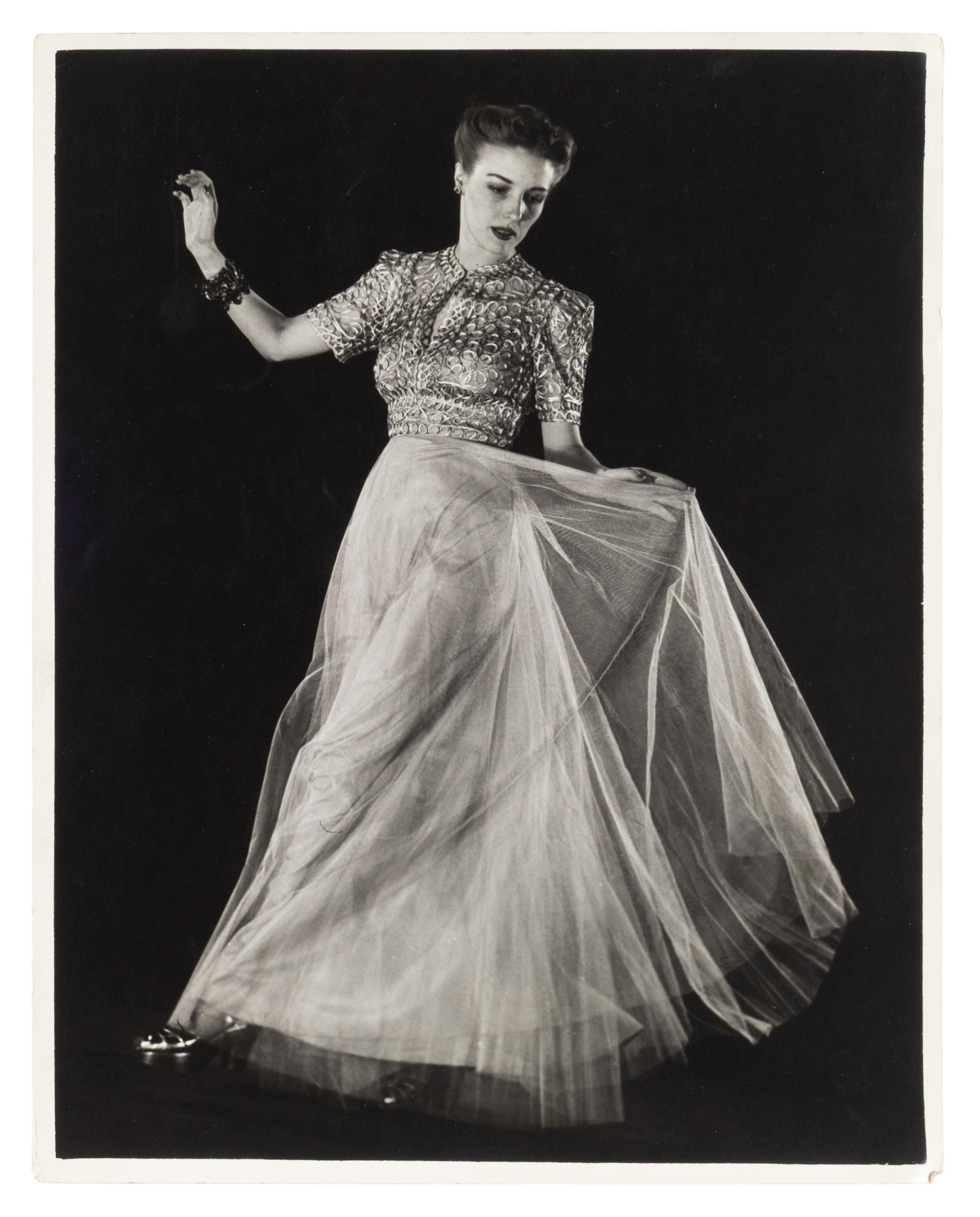 Model wearing evening dress of net skirt with silver metal bodice and Model wearing gold brocade evening dress (two works), 1938; printed ca. 1938