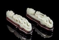 A Pair of Pale-Celadon Jade 'Dragon' Belt Hooks Length of each 4 3/8 inches. — 18TH/19TH CENTURY