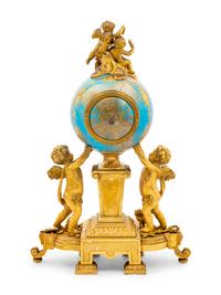 A Sèvres Style Porcelain and Gilt Bronze Mounted Three-Piece Clock Garniture