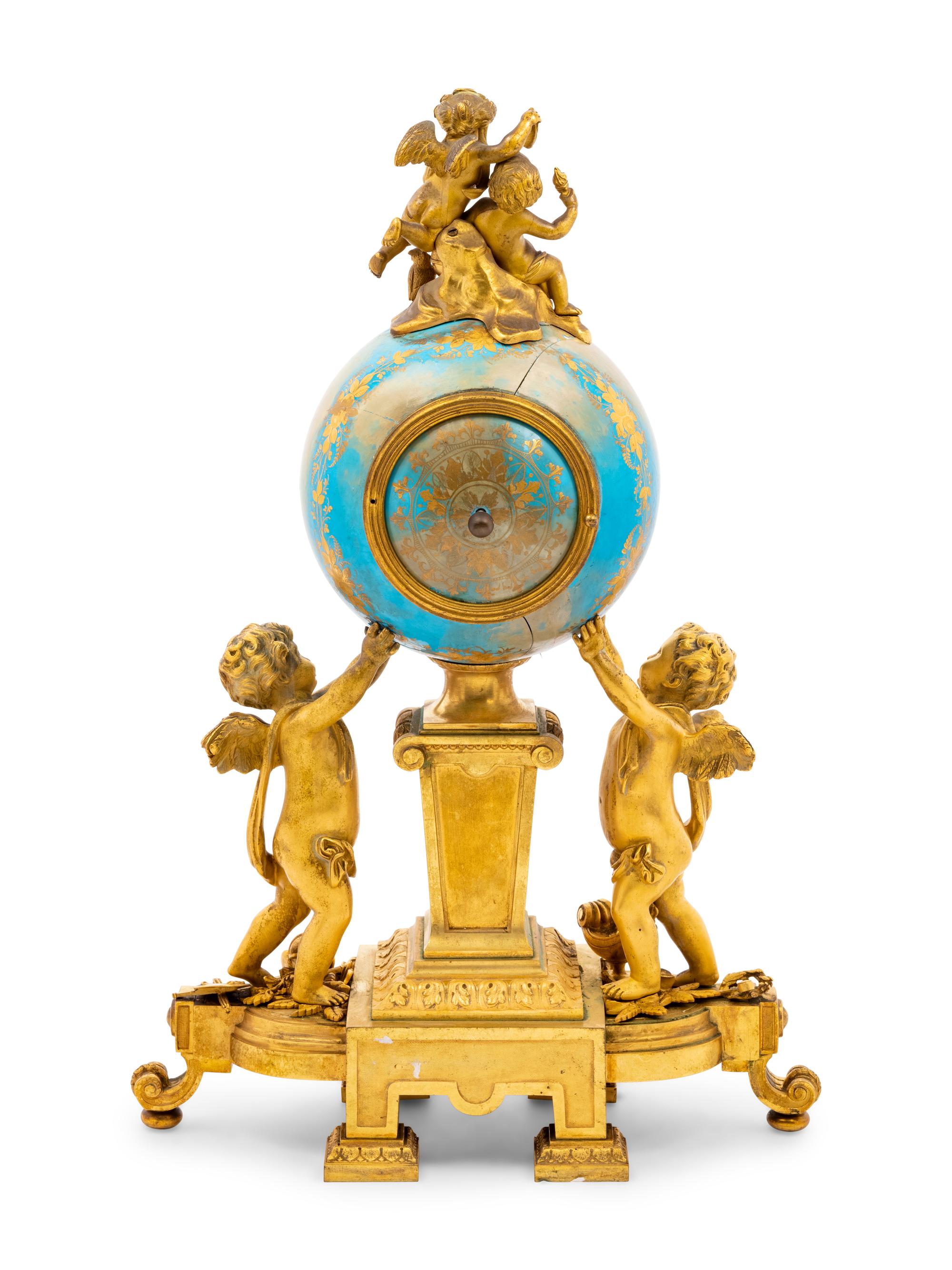 A Sèvres Style Porcelain and Gilt Bronze Mounted Three-Piece Clock Garniture
