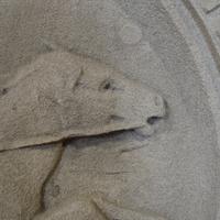 A Carved Limestone Roundel from a Chicago, IL. Post Office Building 37" W x 6" D x 39.5" H — United States, 20th Century