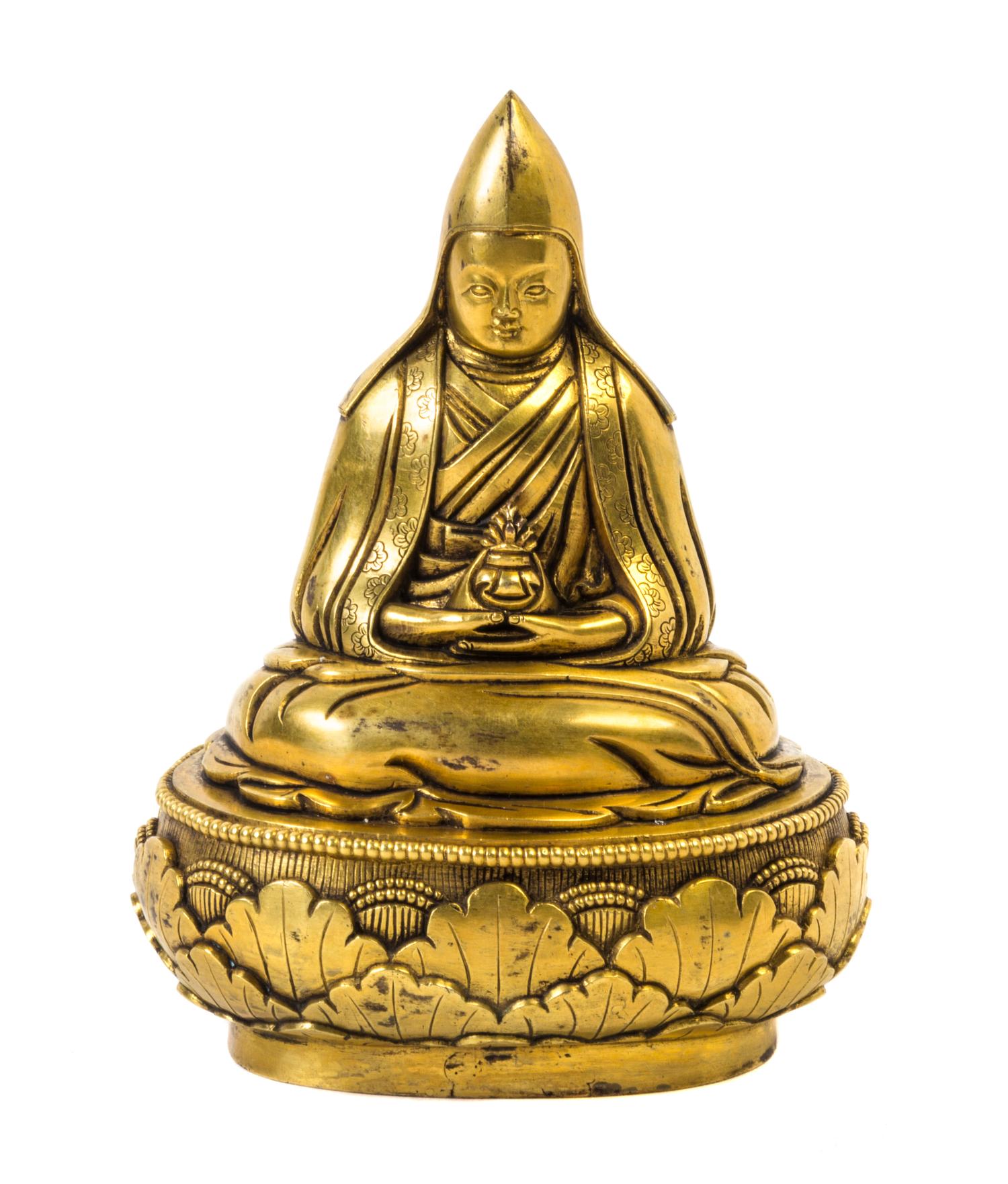 A Sino-Tibetan Gilt Bonze Figure of a Lama — QING DYNASTY