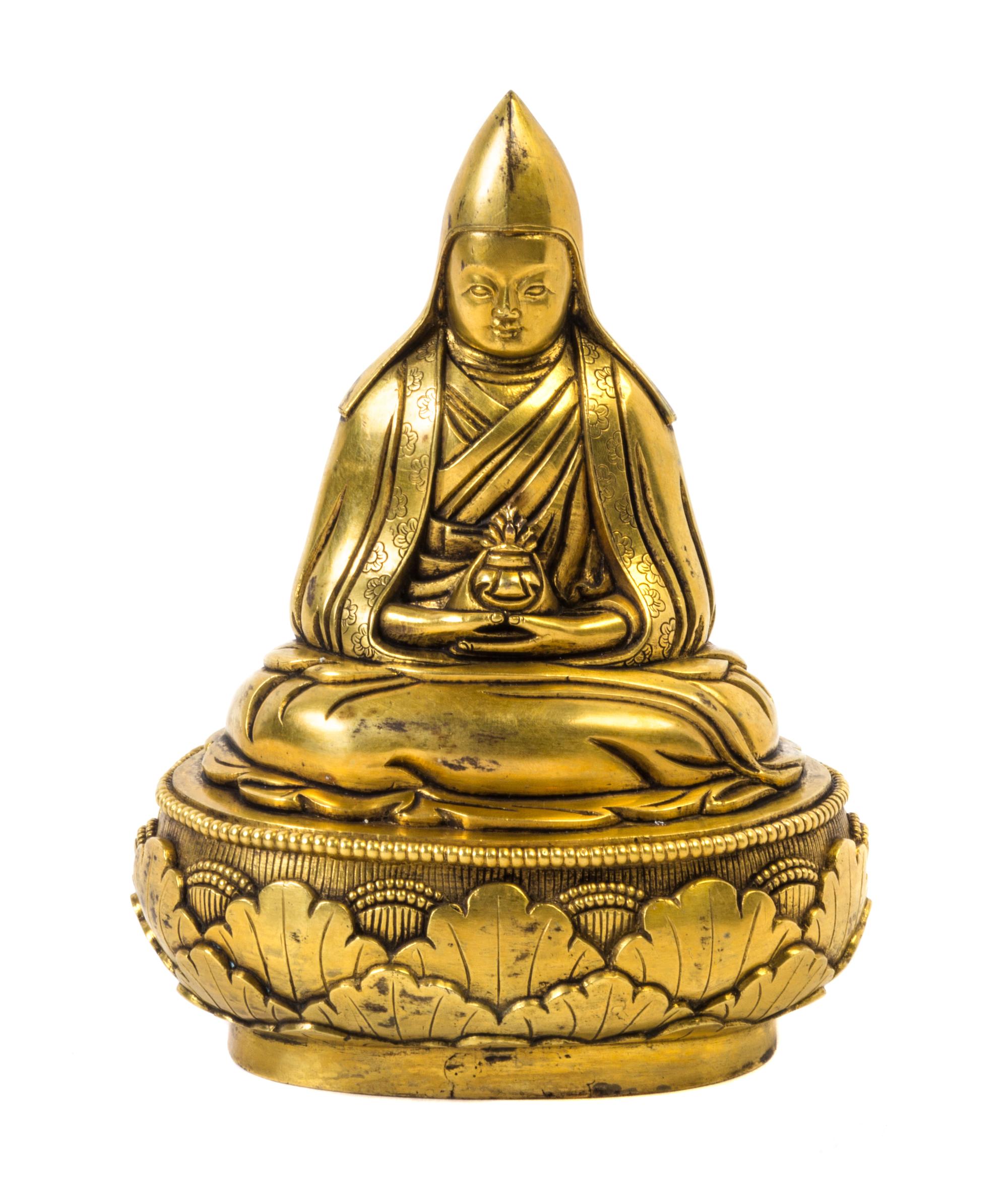 A Sino-Tibetan Gilt Bonze Figure of a Lama — QING DYNASTY