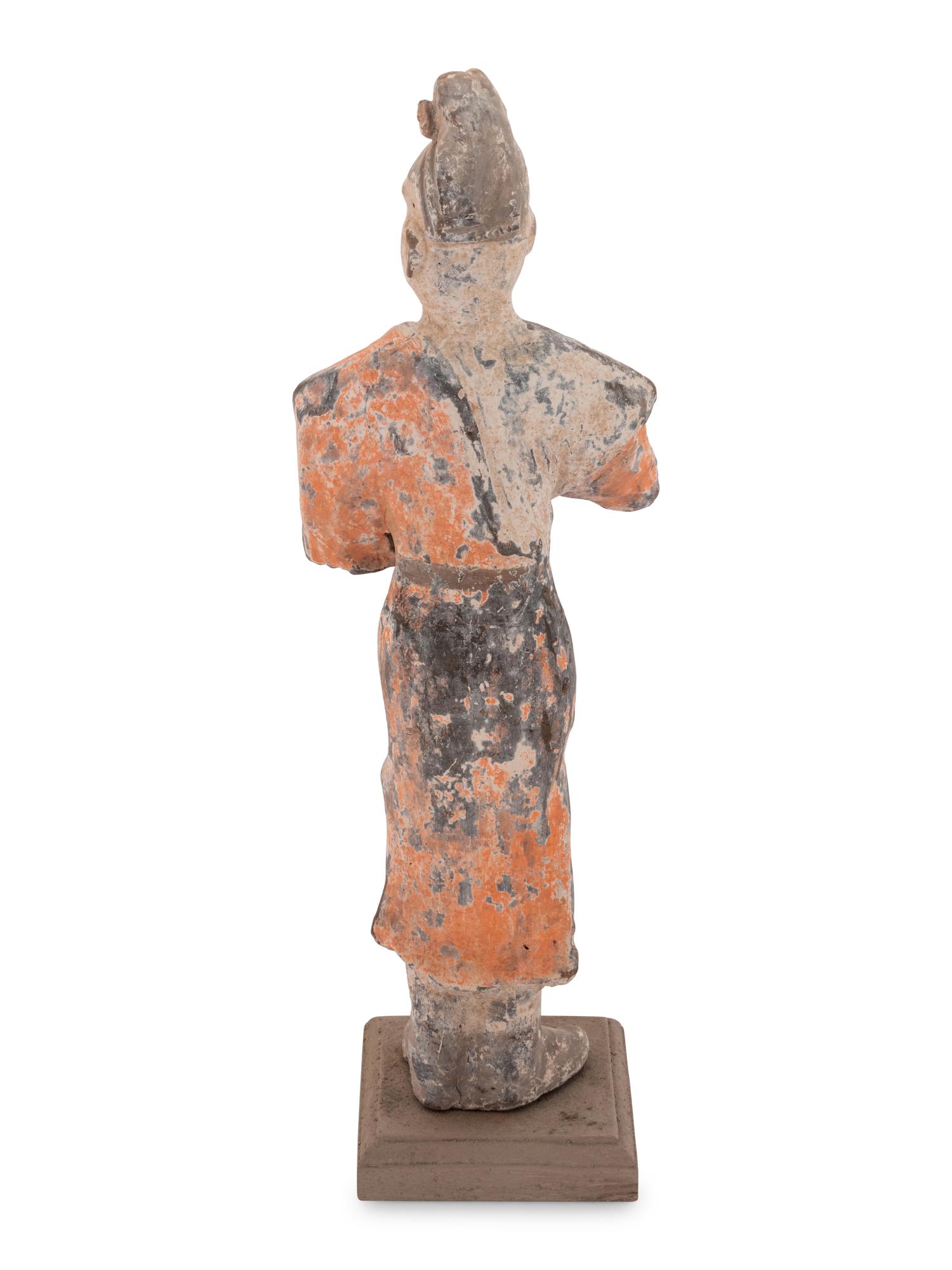 A Chinese Painted Pottery Figure of a Foreign Groom