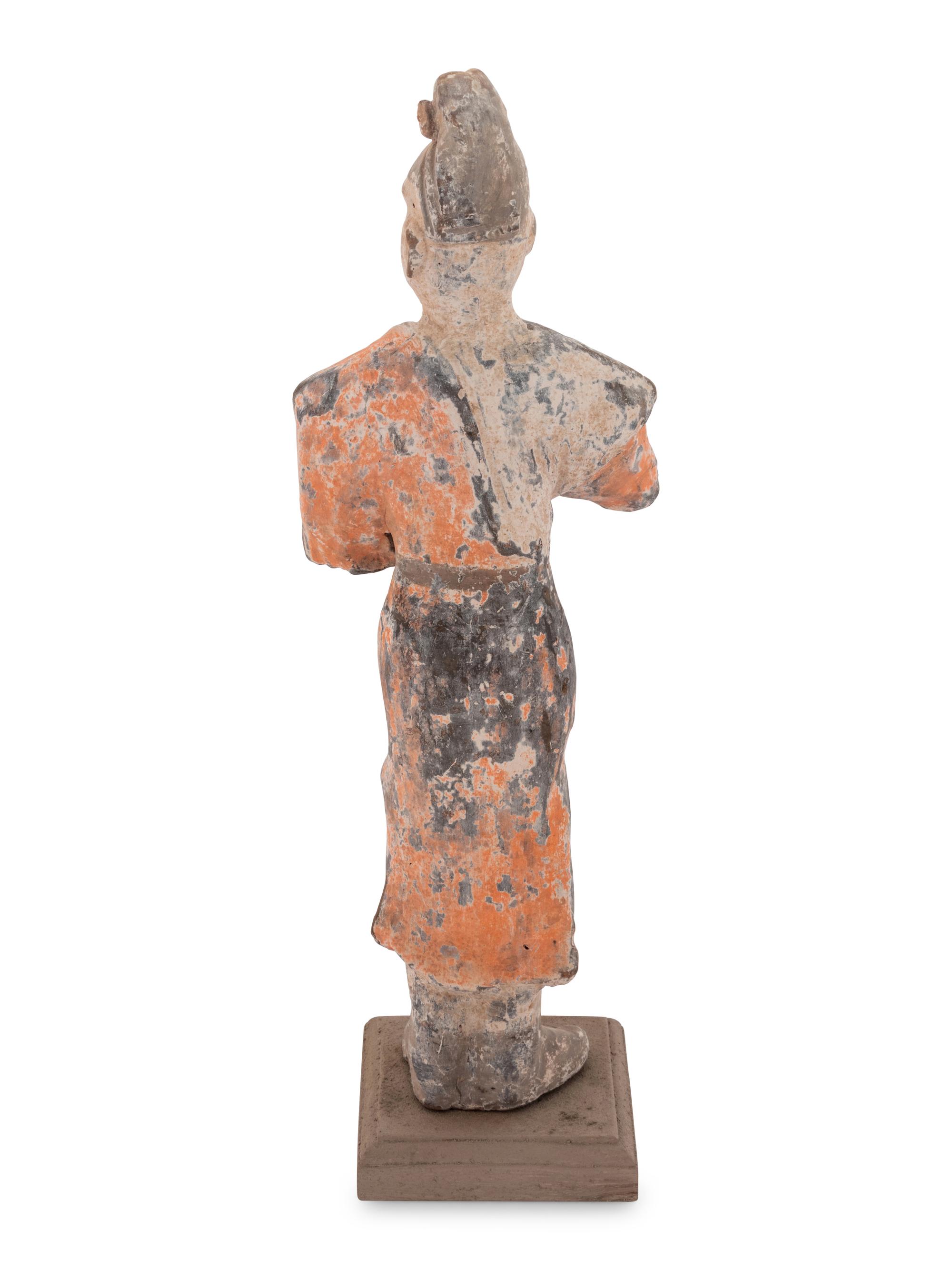 A Chinese Painted Pottery Figure of a Foreign Groom