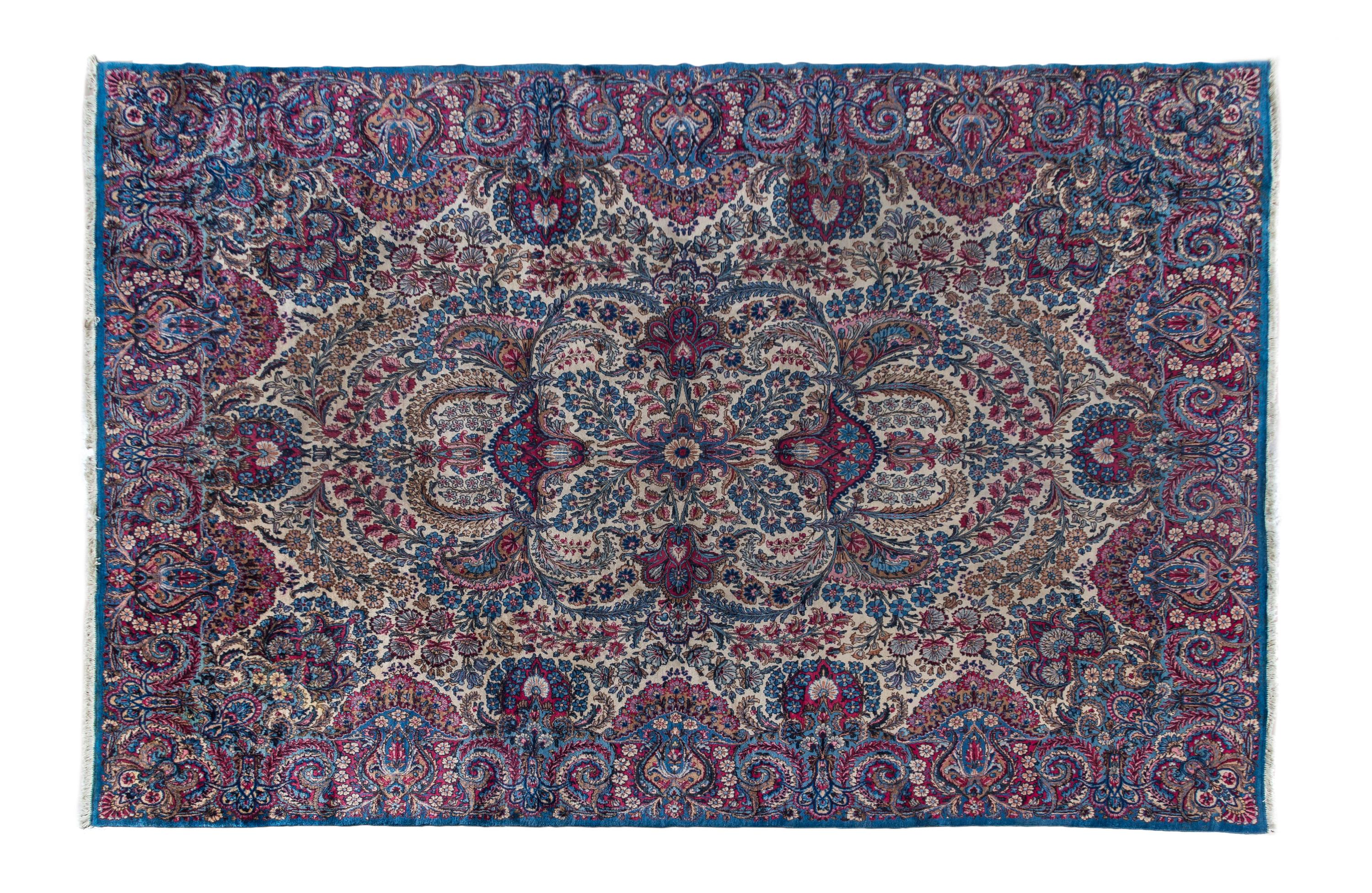 A Kirman Wool Rug 11 feet 7 inches x 8 feet 10 inches.