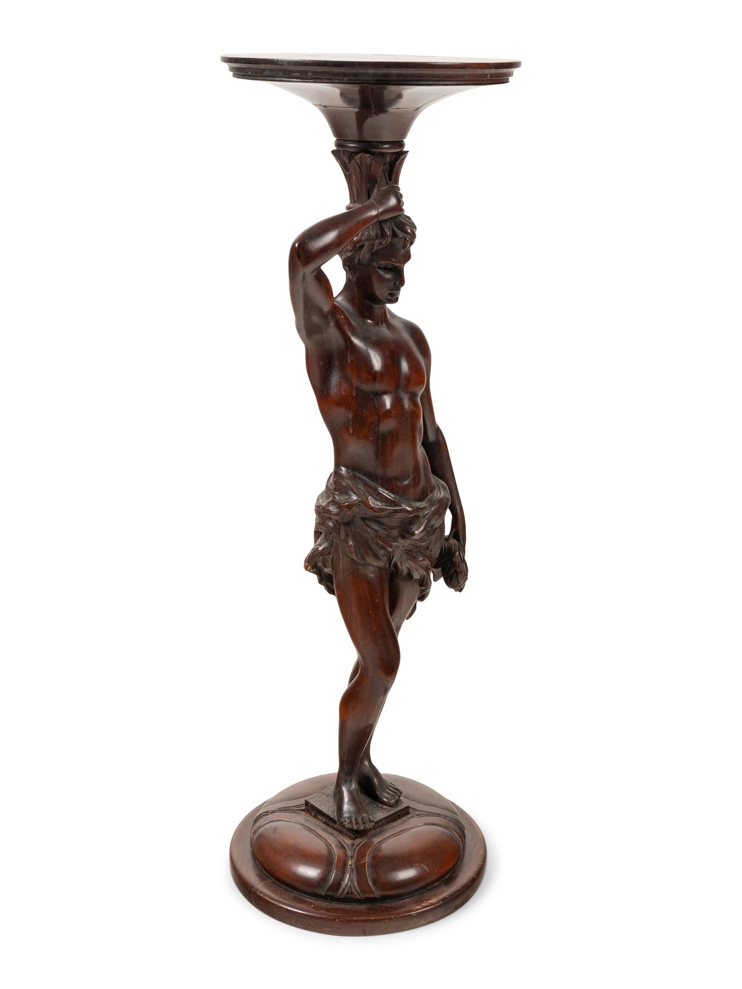 A Continental Carved Mahogany Figural Pedestal
