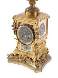 A French Gilt Bronze and Specimen Marble Three-Piece Clock Garniture