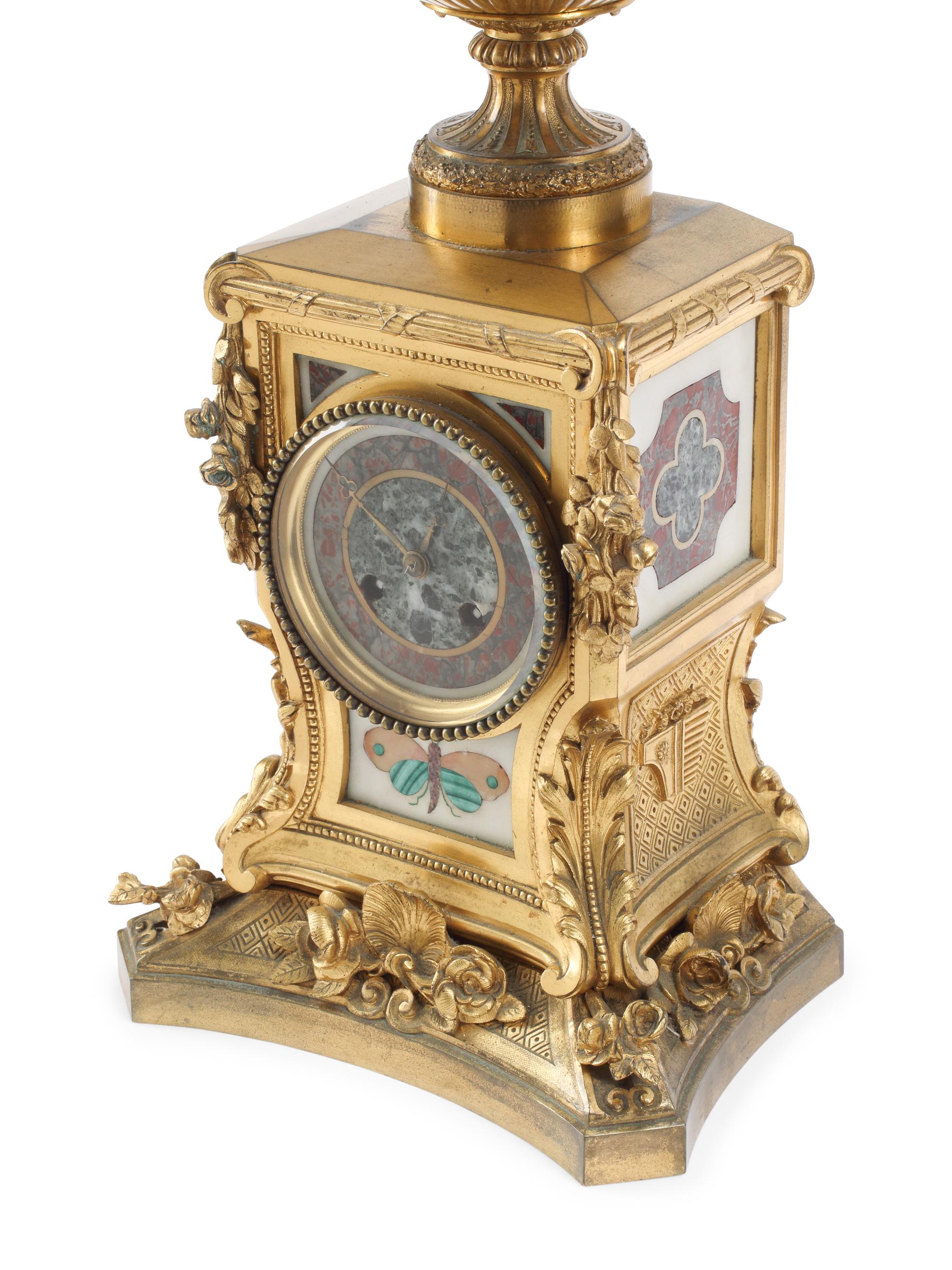 A French Gilt Bronze and Specimen Marble Three-Piece Clock Garniture