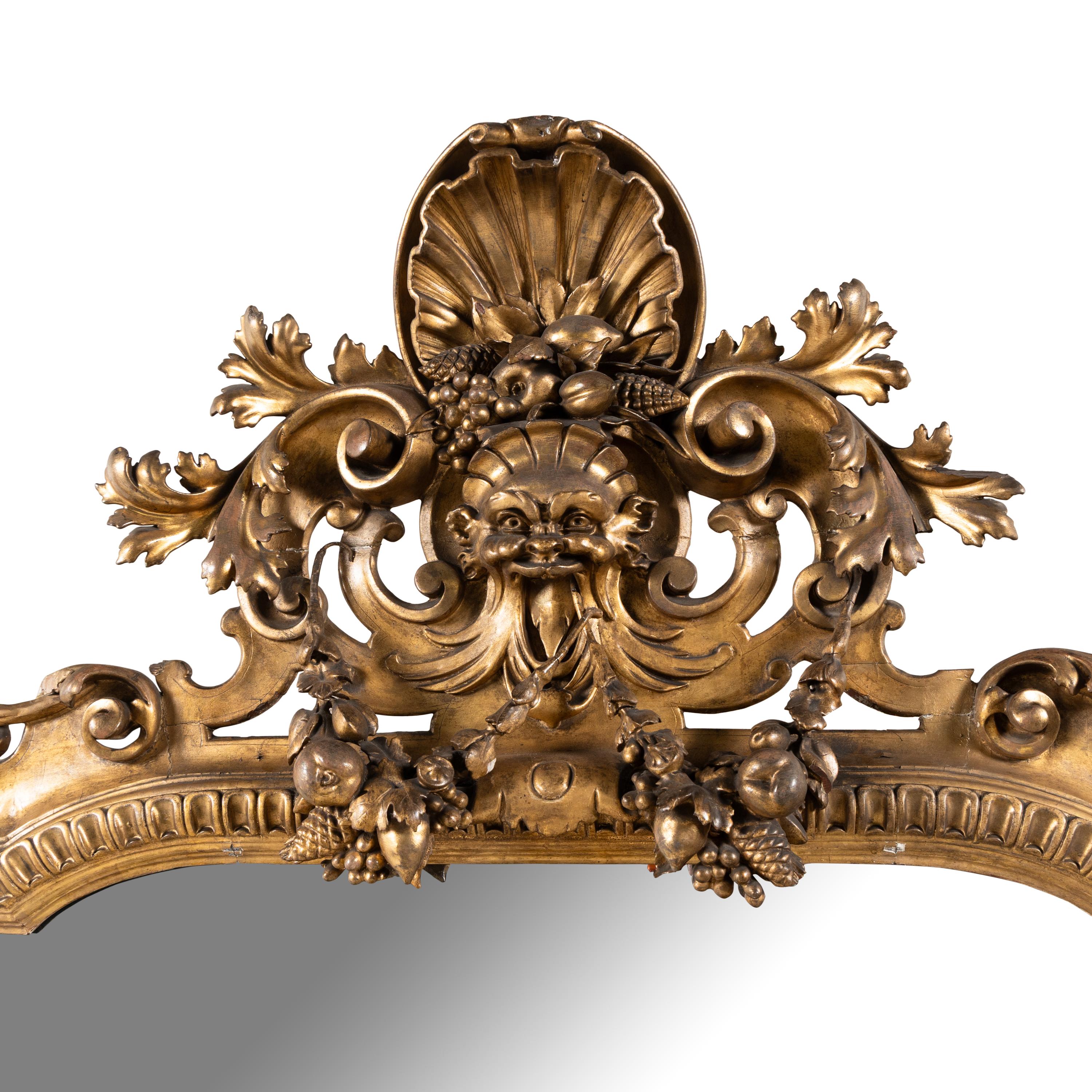An Italian Baroque Style Giltwood Mirror
