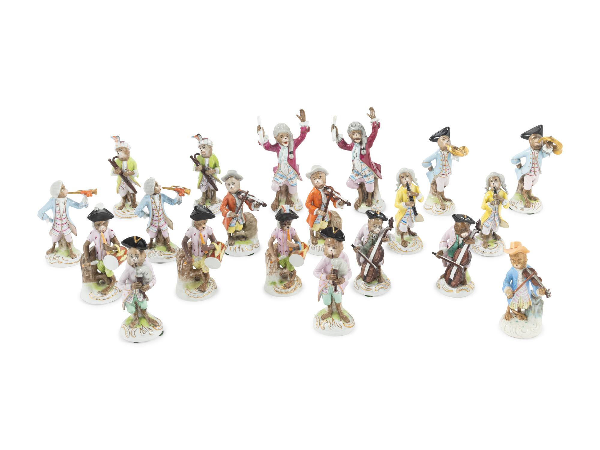 An Assembled Group of Nineteen Sitzendorf Porcelain Monkey Band Figures