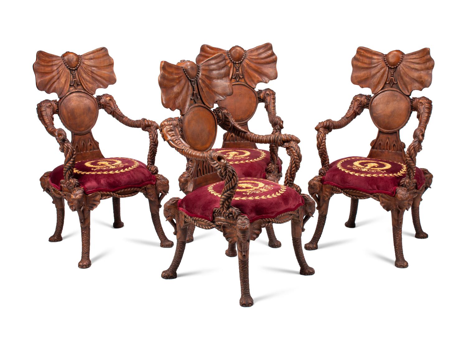 A Set of Four Carved Walnut Elephant Motif Fantasy Chairs