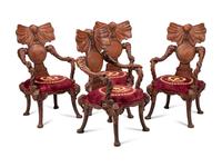 A Set of Four Carved Walnut Elephant Motif Fantasy Chairs