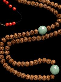 A Chinese Carved Seed Court Necklace, Chaozhu