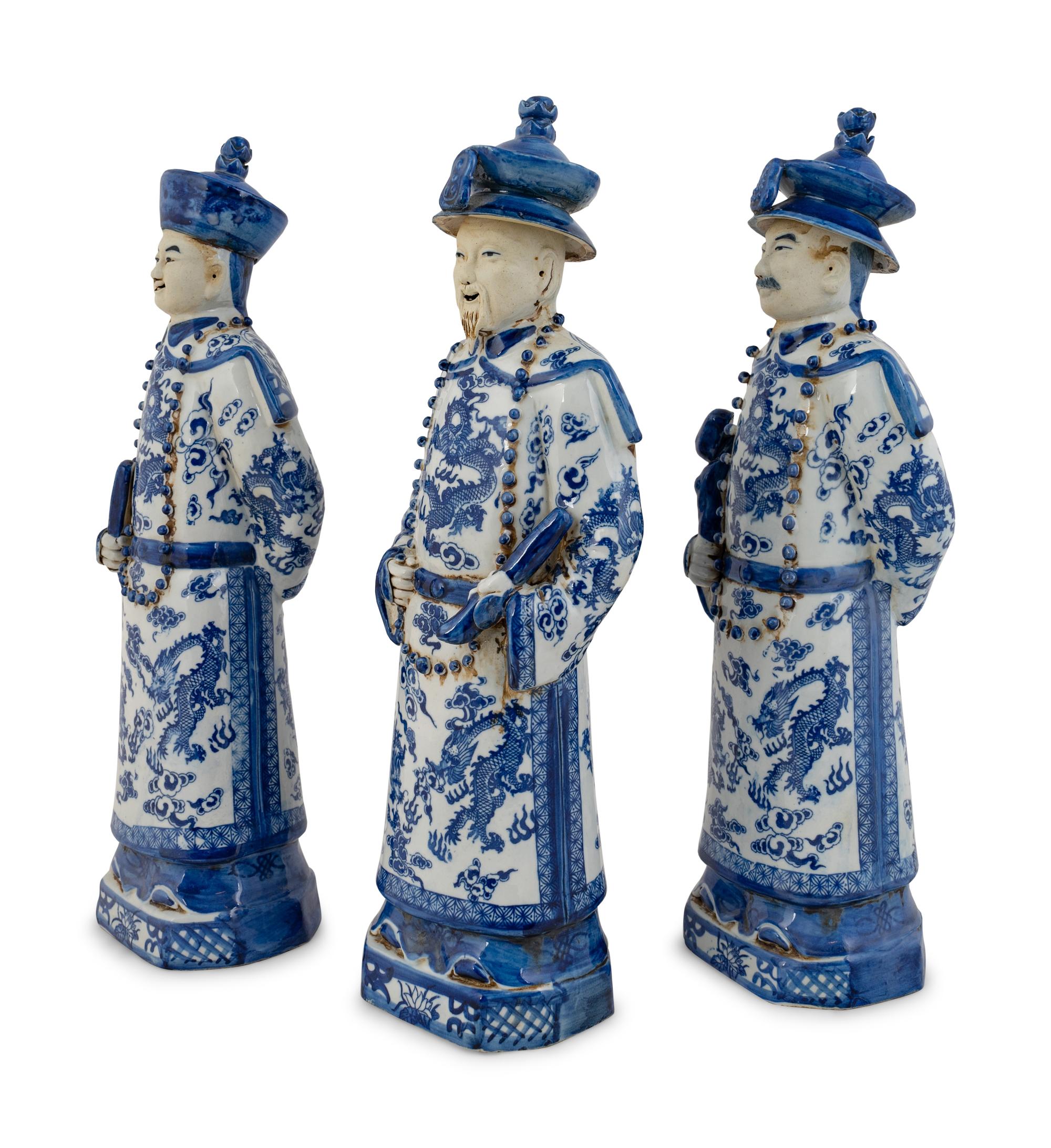 A Group of Three Chinese Blue and White Porcelain Figures of Officials — 20TH CENTURY