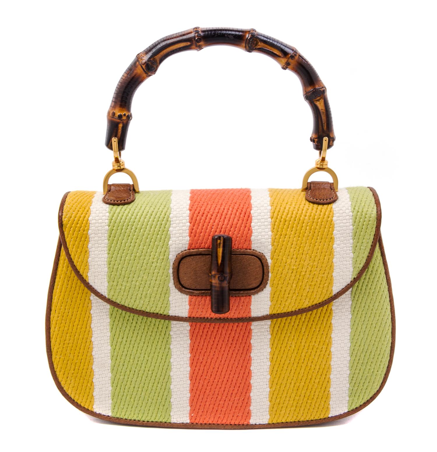 A Gucci Brown Leather and Woven Bamboo Top Handle Handbag, 10.5" x 7" x 3".