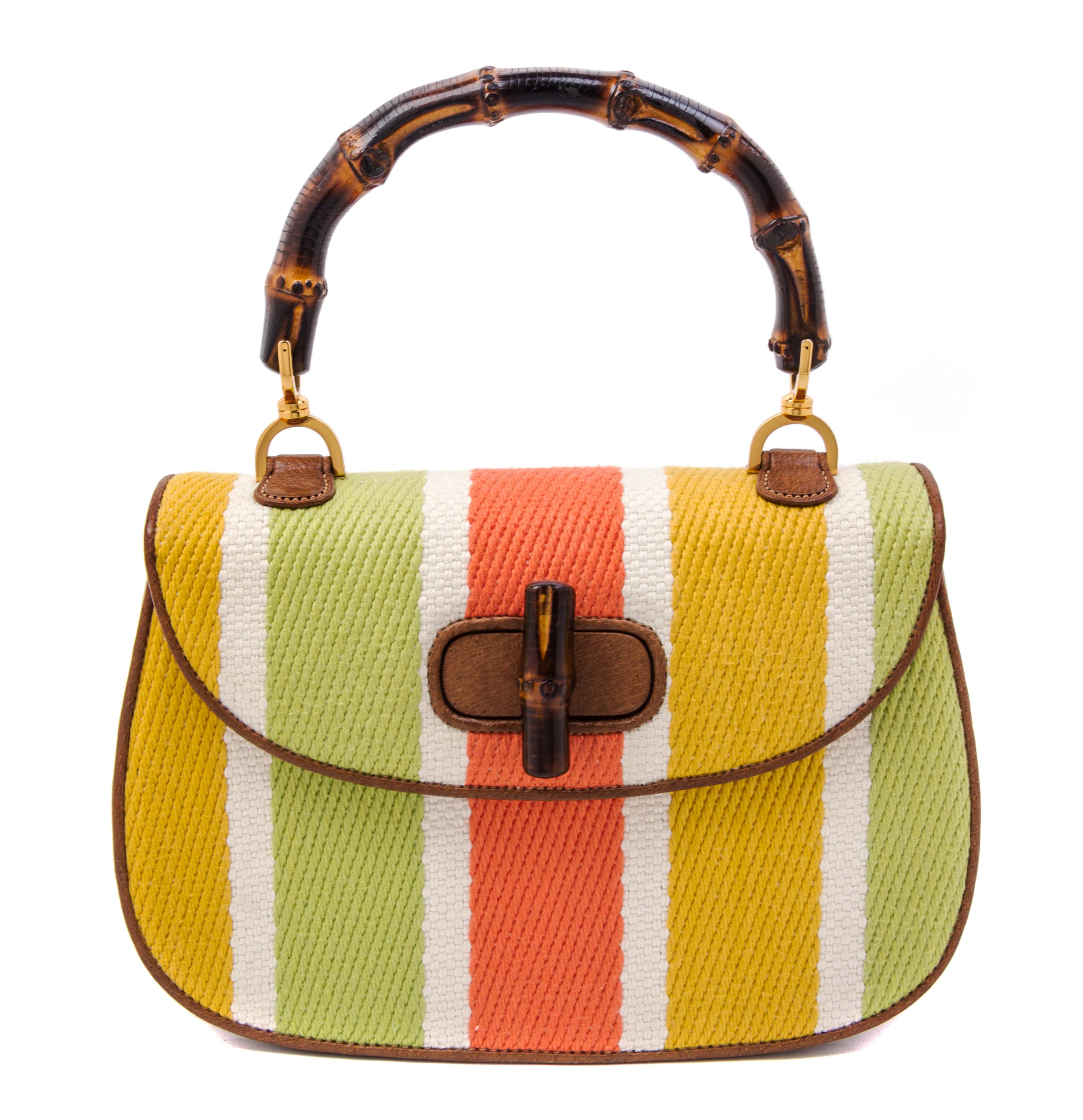 A Gucci Brown Leather and Woven Bamboo Top Handle Handbag, 10.5" x 7" x 3".