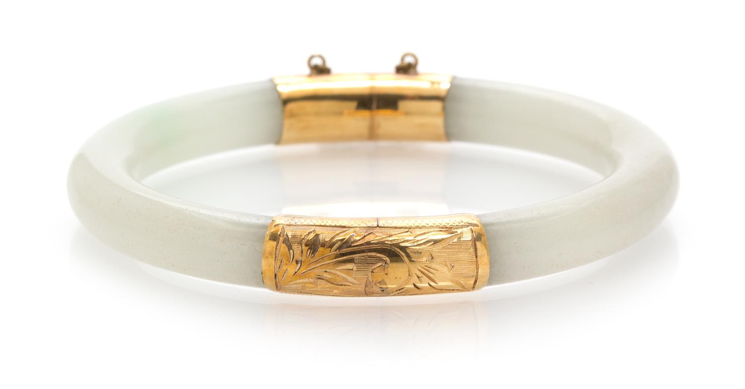 A 14 Karat Yellow Gold and Jade Bangle,