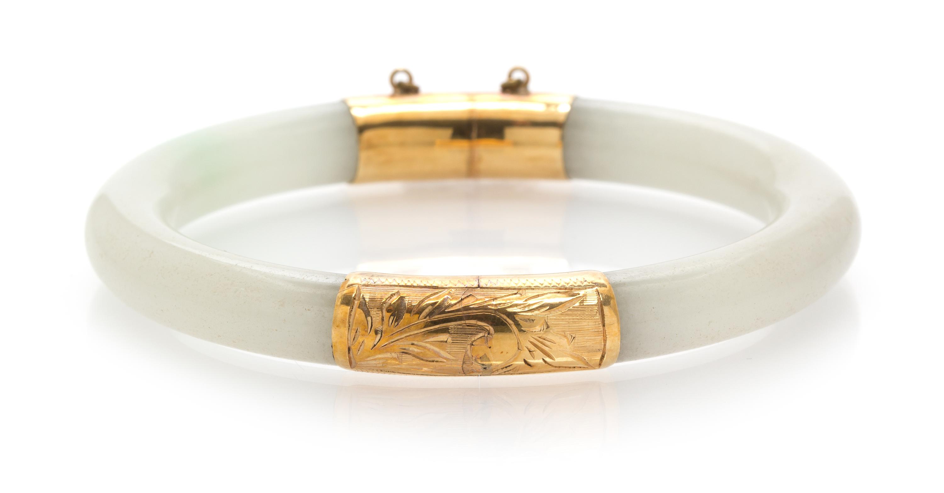 A 14 Karat Yellow Gold and Jade Bangle,