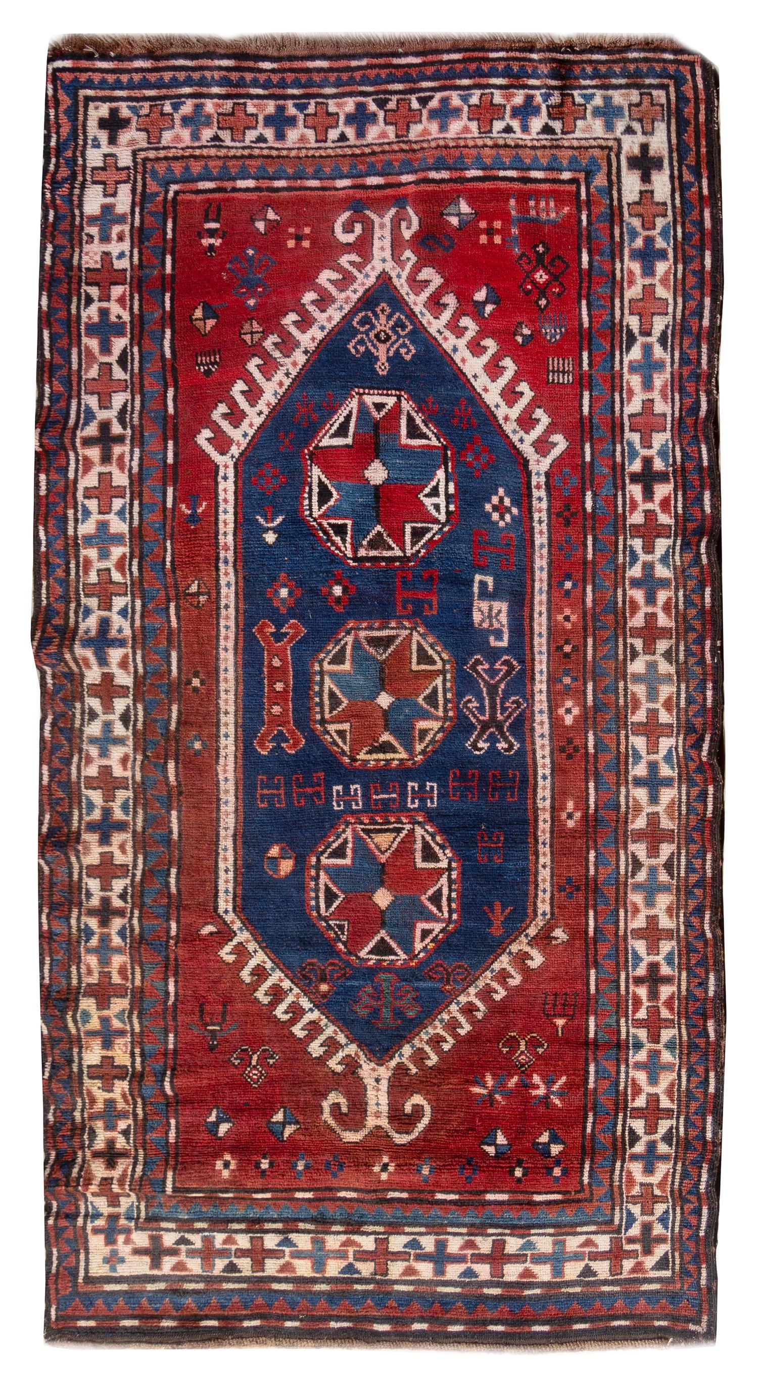 A Kazakh Wool Rug 6 feet 7 inches x 4 feet 7 inches. — 20TH CENTURY