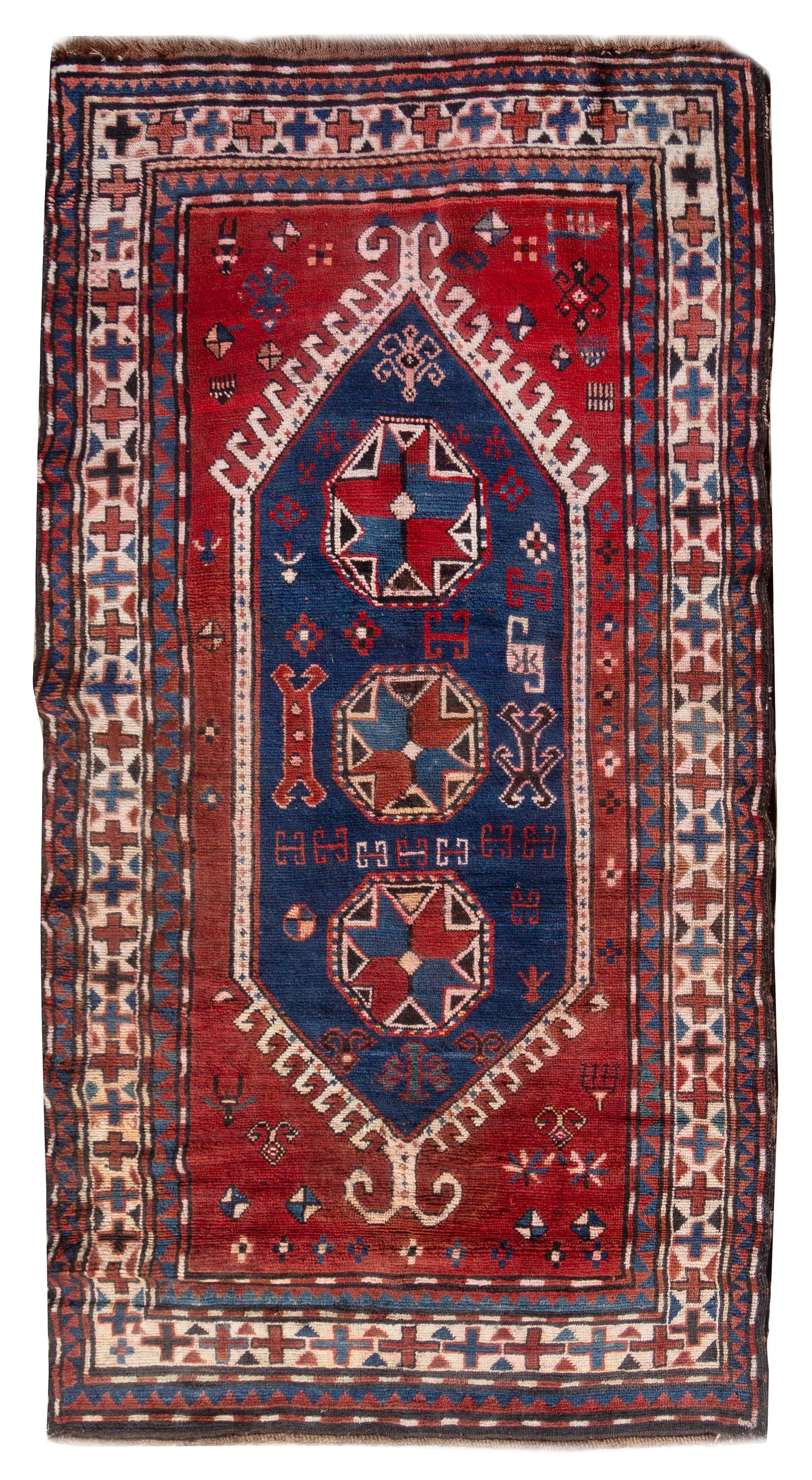 A Kazakh Wool Rug 6 feet 7 inches x 4 feet 7 inches. — 20TH CENTURY