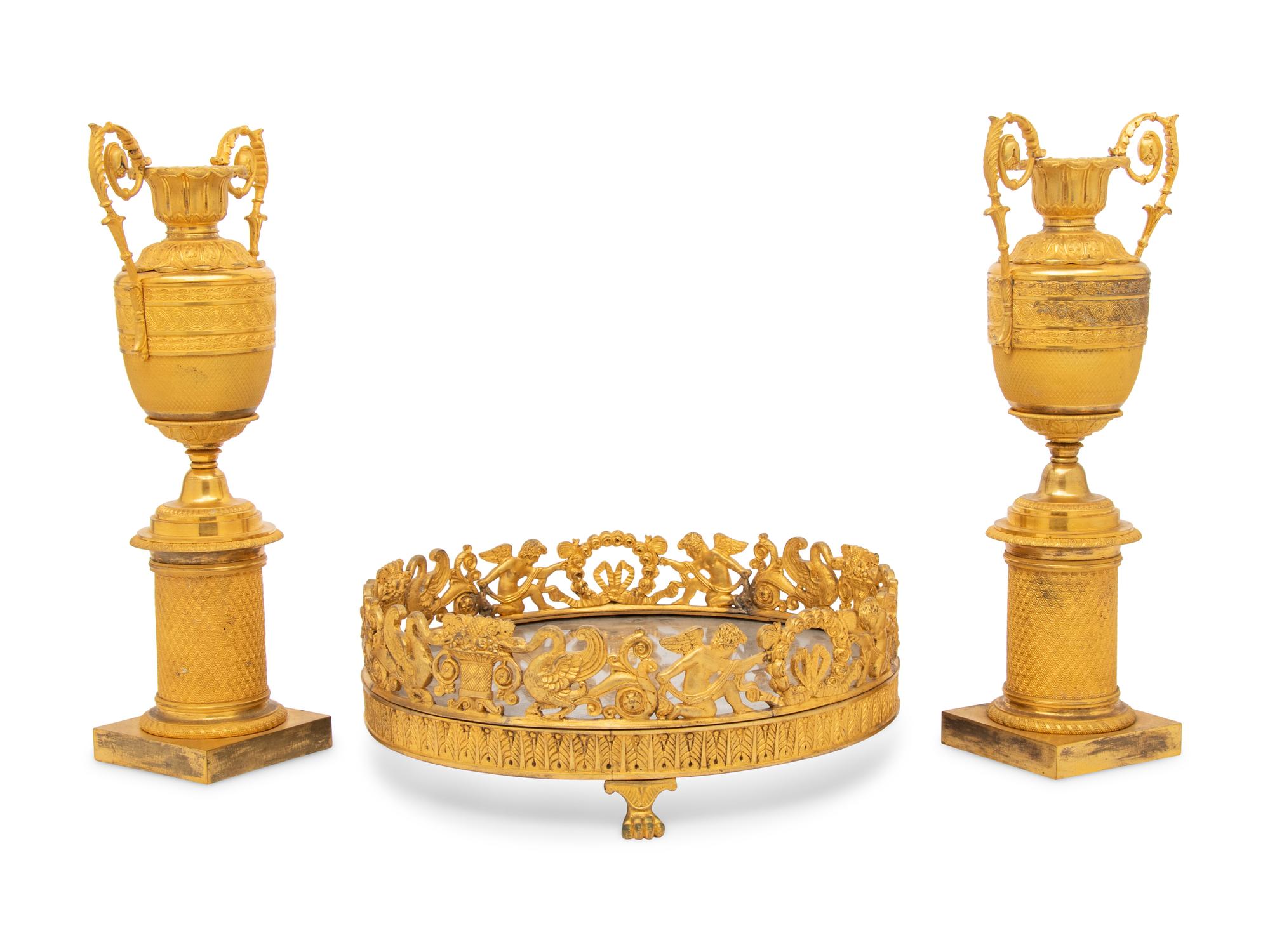 A Louis-Philippe Gilt Bronze Surtout de Table and a Pair of Restauration Gilt Bronze Urns