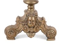 A Pair of Continental Brass Andirons with Masks