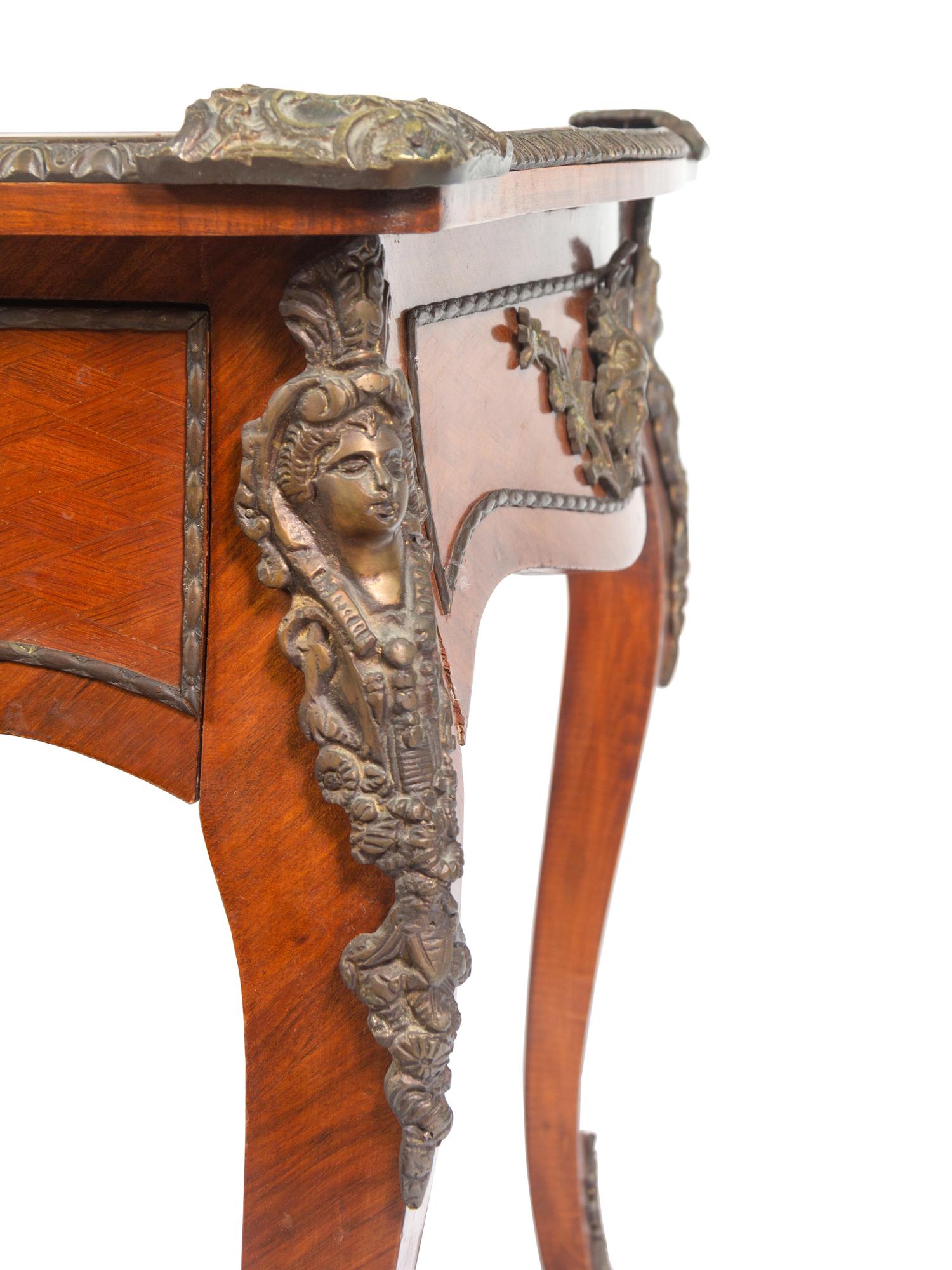 A Louis XV Style Gilt Metal Mounted Walnut Bureau Plat