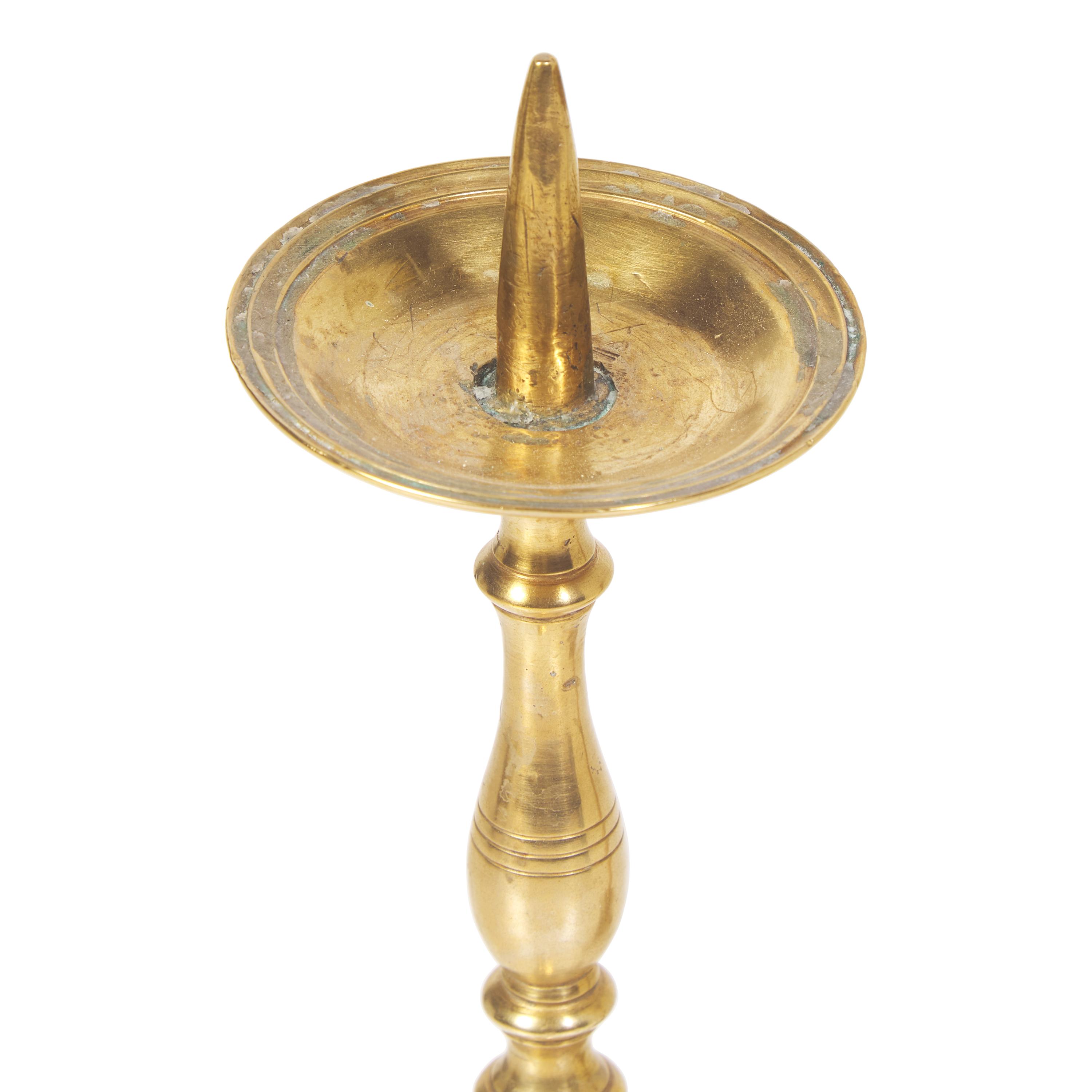 A Pair of Baroque Brass Pricket Candlesticks