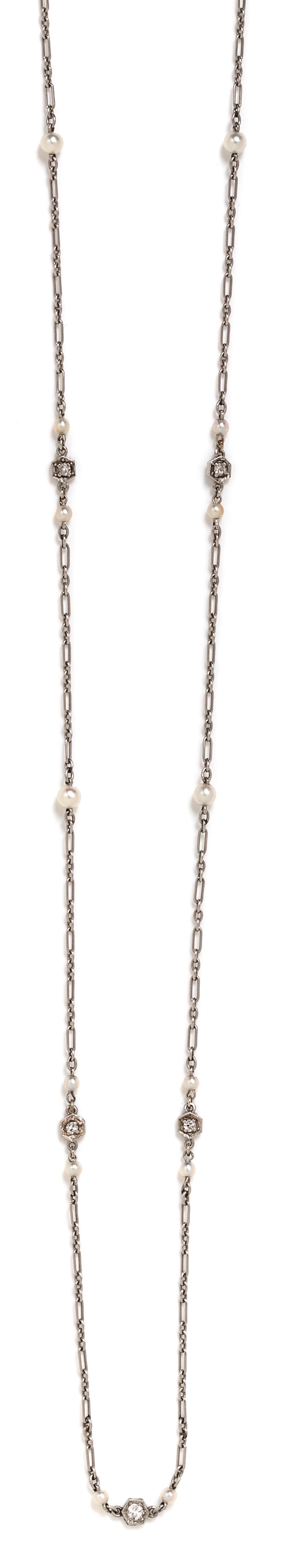 A Platinum, Diamond and Seed Pearl Longchain Necklace, 4.70 dwts.