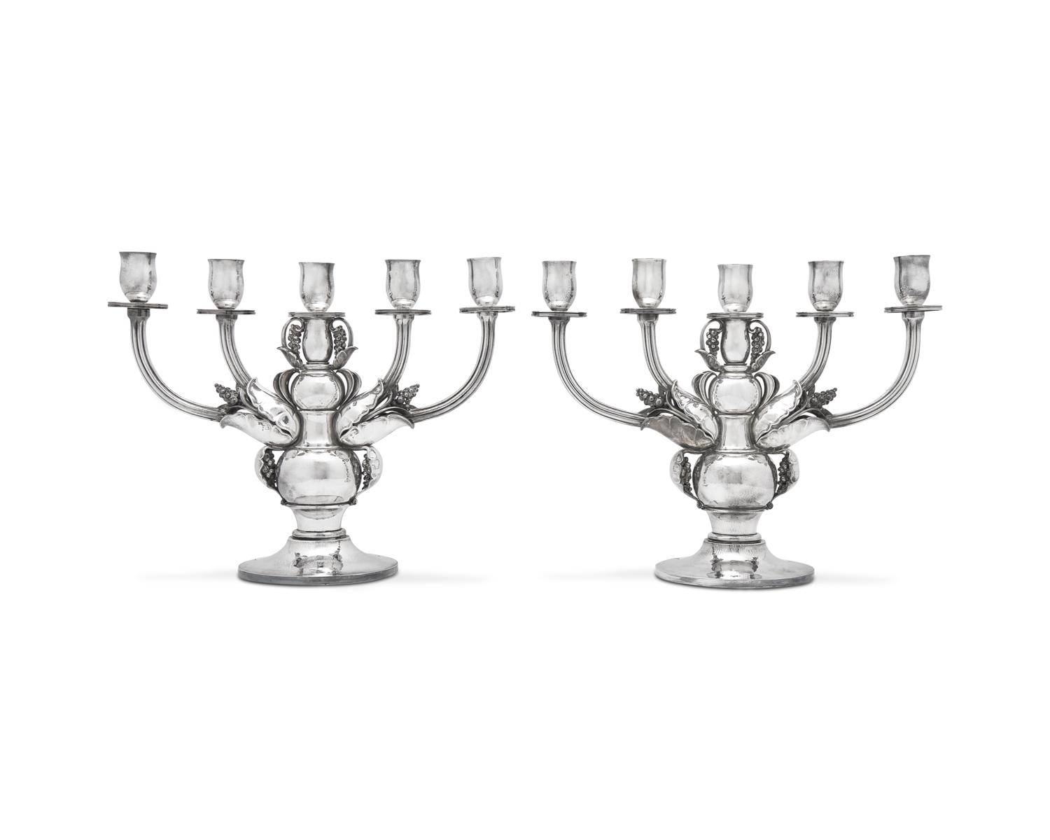A Pair of Georg Jensen Designed Silver Five-Light Candelabra