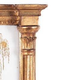 A Classical Giltwood and Eglomise Panel Inset Looking Glass