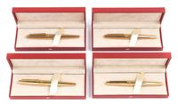 A Group of Four S.T. Dupont Gold-Plated Ellipsis Fountain Pens