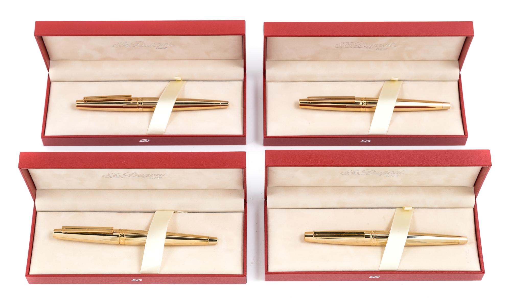 A Group of Four S.T. Dupont Gold-Plated Ellipsis Fountain Pens