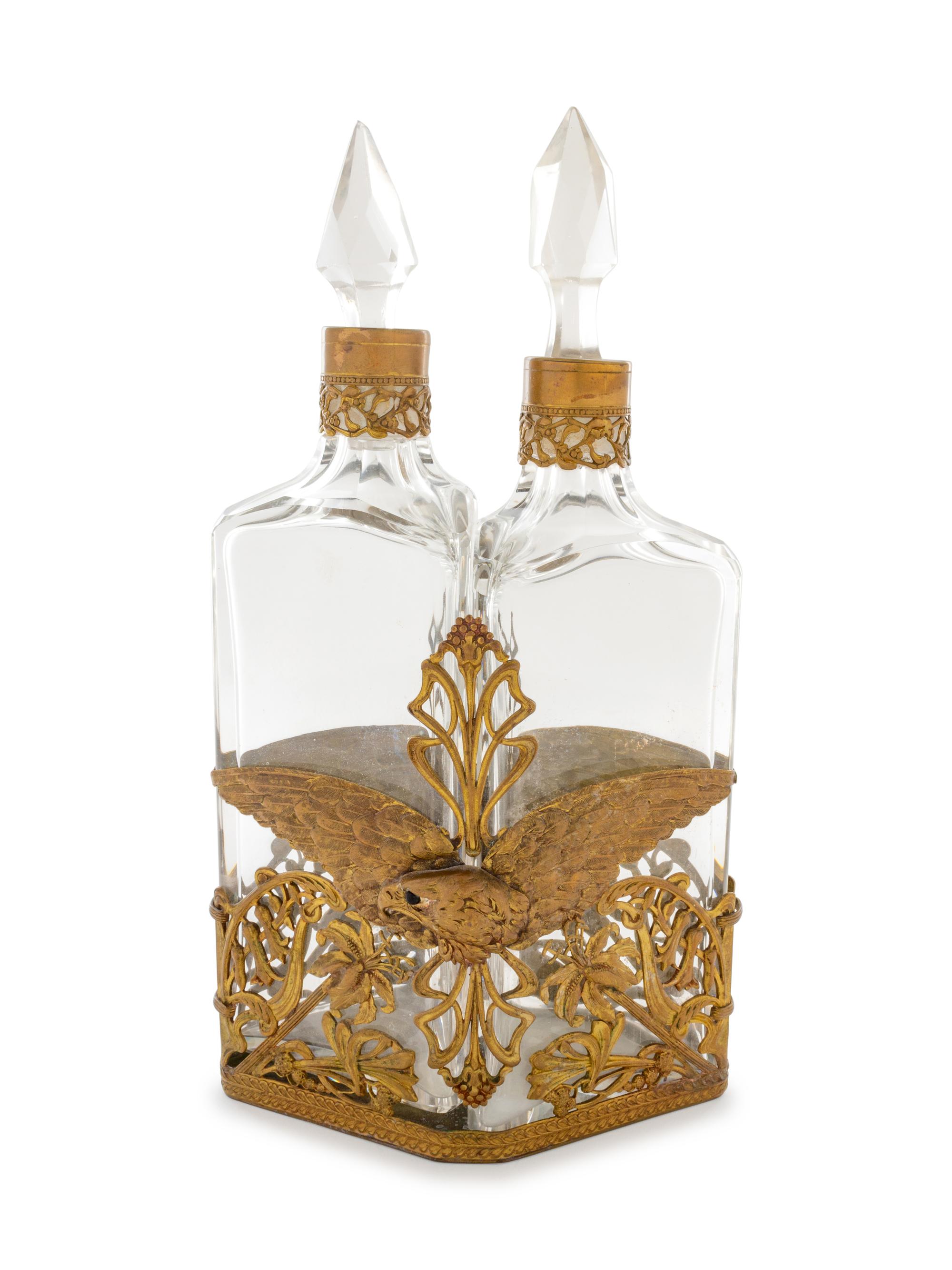 An Art Nouveau Bronze Bottle Caddy