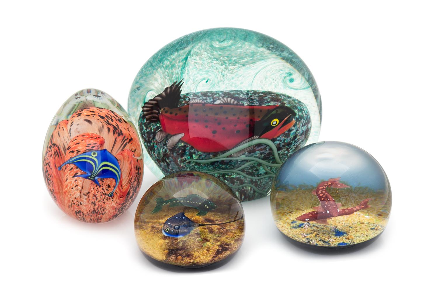 Orient & Flume and Caithness, , four glass paperweights, each decorated with aquatic life