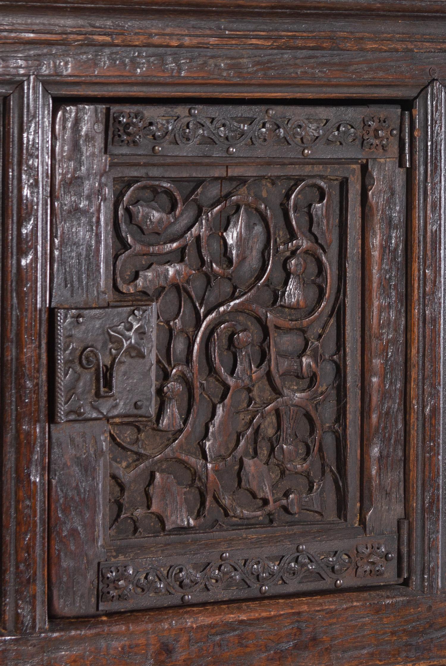 A Gothic Revival Carved Oak Cabinet on Stand