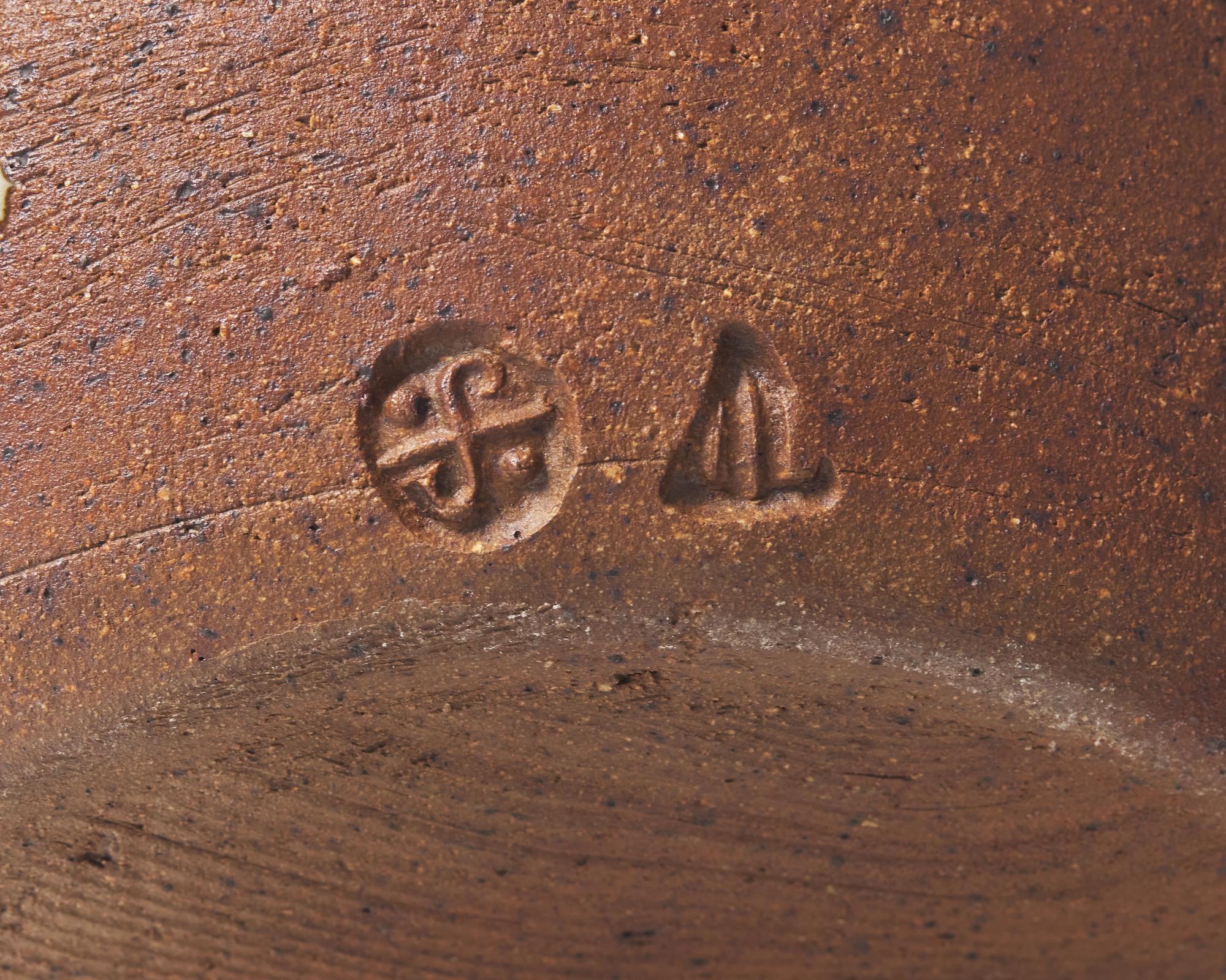 Bulbous vase with lugs
