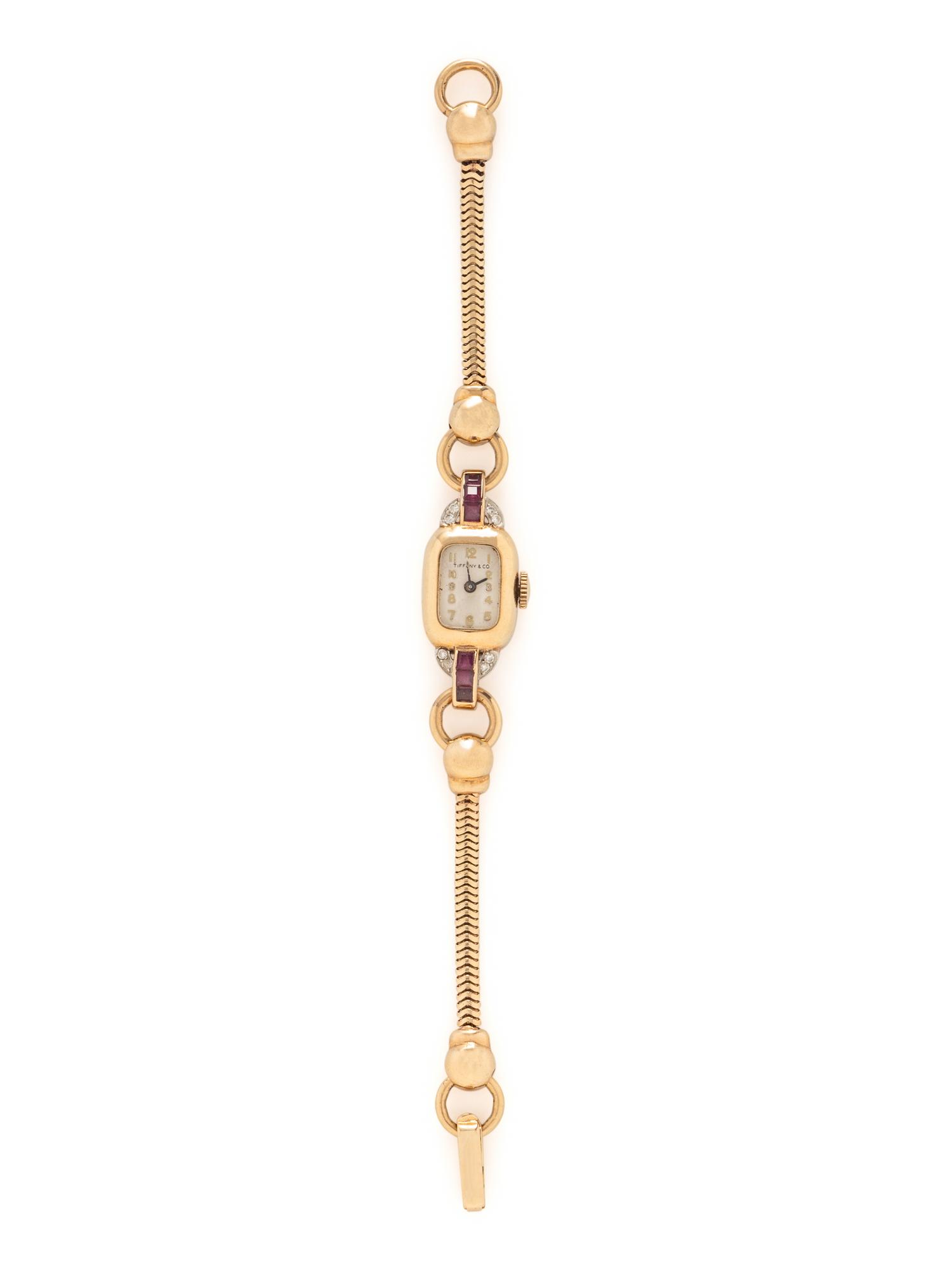 TIFFANY & CO., YELLOW GOLD, RUBY AND DIAMOND WATCH