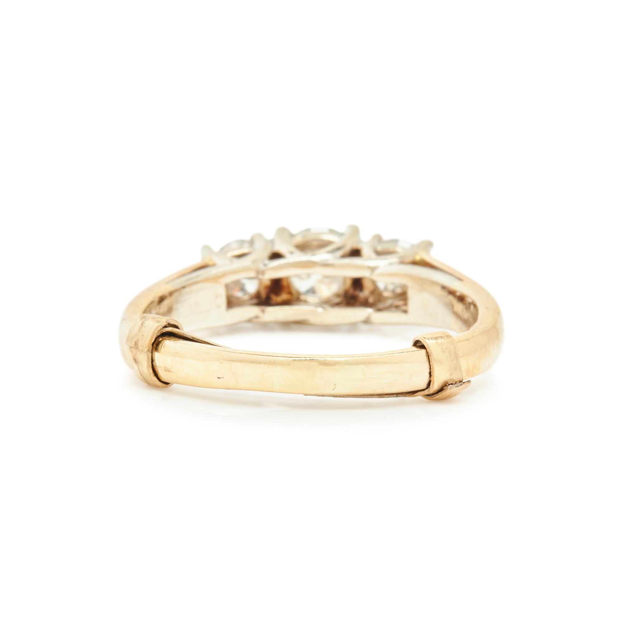 YELLOW GOLD AND DIAMOND THREE STONE RING